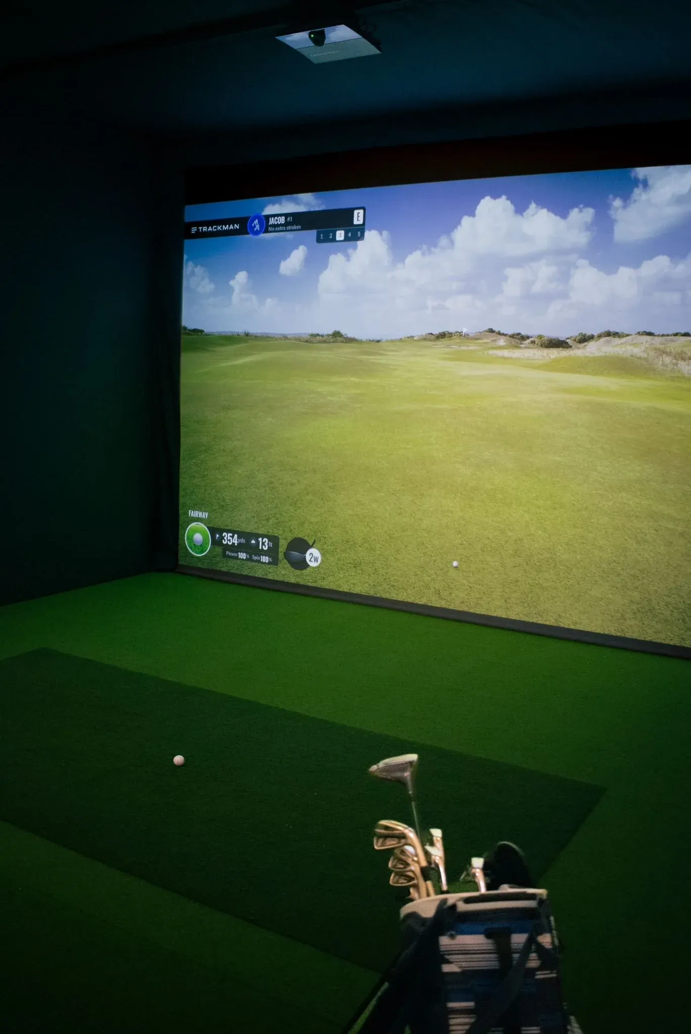 A member playing a round on a Trackman simulator